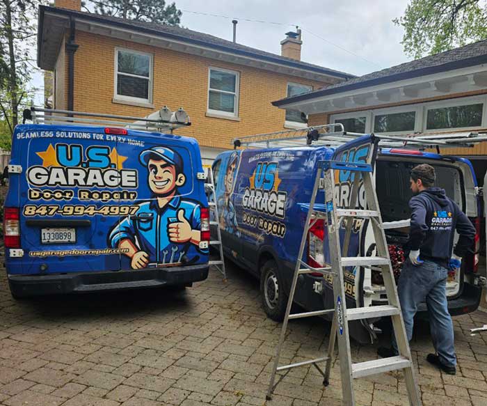 US Garage Door Repair work trucks near a Vernon Hills IL garage door repair job